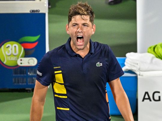 Filip Krajinović reacts after winning against Malek Jaziri at the Dubai Duty Free Tennis Championships