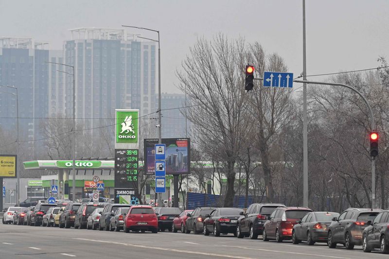 People queue to a petrol station in Kyiv.