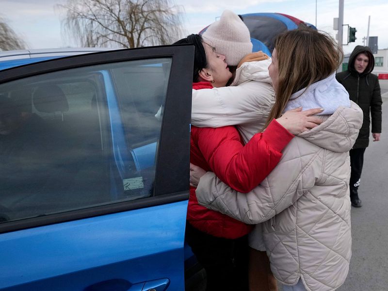 A woman hugs another women upon her arrival at the border crossing in Medyka, southeastern Poland, from neighboring Ukraine.