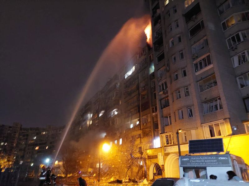 Firefighters extinguish a blaze at a damaged residential building at Koshytsa Street, a suburb of the Ukrainian capital Kyiv. 