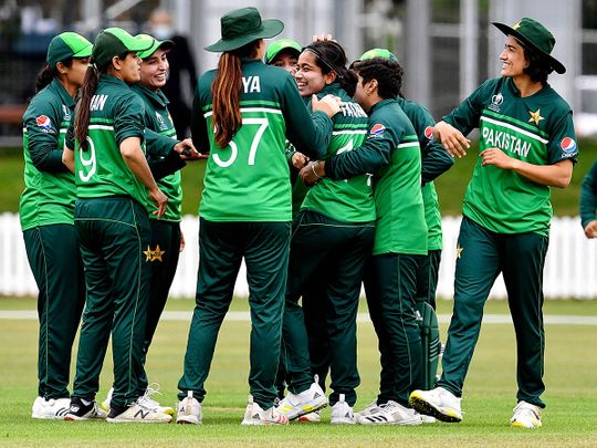 Pakistan's Fatima Sana is congratulated by her teammates after dismissal of New Zealand's Sophie Devine 