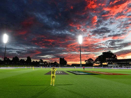 Beth Mooney of Australia fielding on the boundary as the sun sets during the ICC Women's Cricket World Cup 2022 cricket match against England 