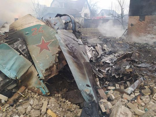 Remains of the Russian fighting aircraft are seen at a residential area, in Chernihiv, Ukraine. 