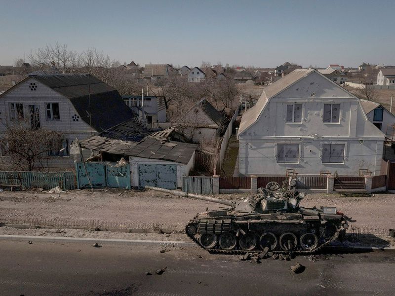 A destroyed Russian tank is seen on a main road near Brovary, north of Kyiv