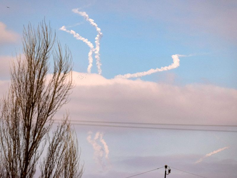 A picture shows anti-aircraft missiles in the sky a few kilometers from Kyiv, Ukraine. 
