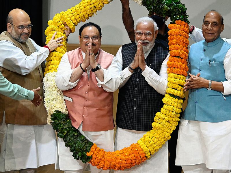 India's Prime Minister Narendra Modi and Bharatiya Janata Party National President JP Nadda being felicitated by Union Ministers Amit Shah and Rajnath Singh during the BJP Parliamentary Party Meeting at Ambedkar International Center, in New Delhi on Tuesday. 