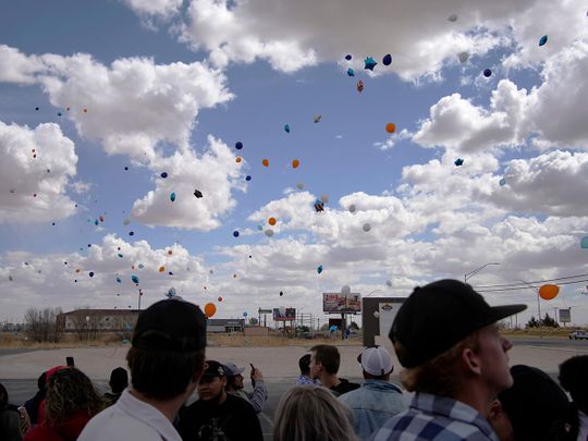 Balloons are relased during a memorial for Jackson Zinn, one of the student golfers of University of the Southwest who died in a crash in Texas