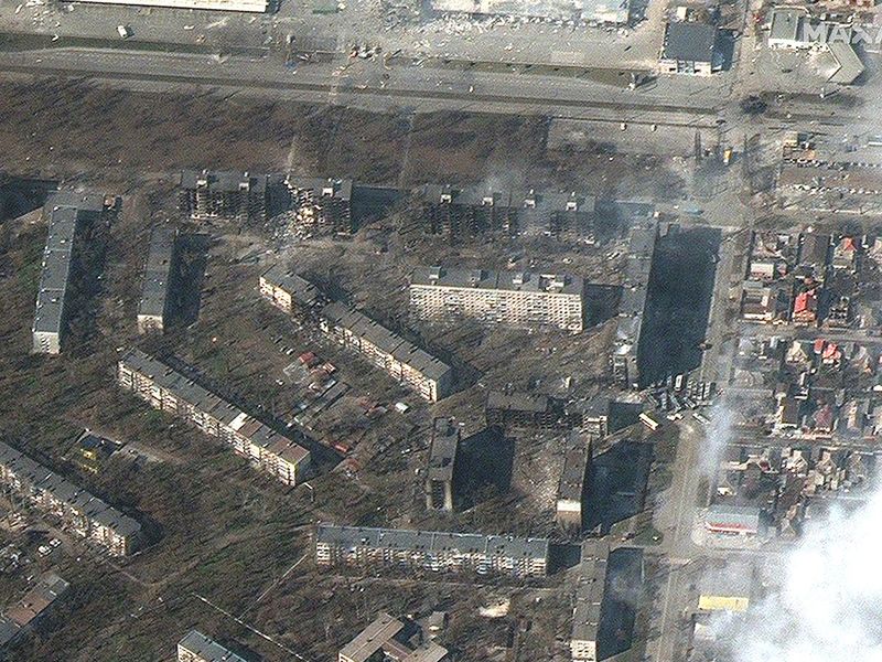 Satellite view of burning, heavily damaged apartment buildings and stores, as Russia's attack of Ukraine continues, Mariupol. 