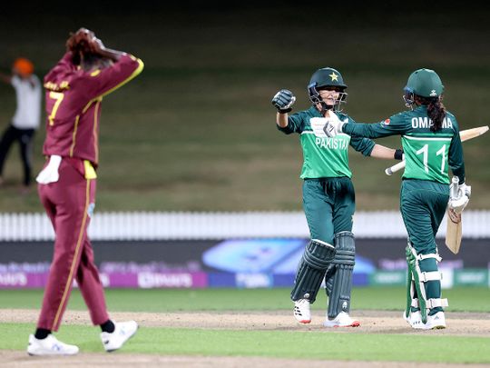 Pakistan's Bismah Maroof (C) and Omaima Sohail (R) celebrate defeating West Indies 