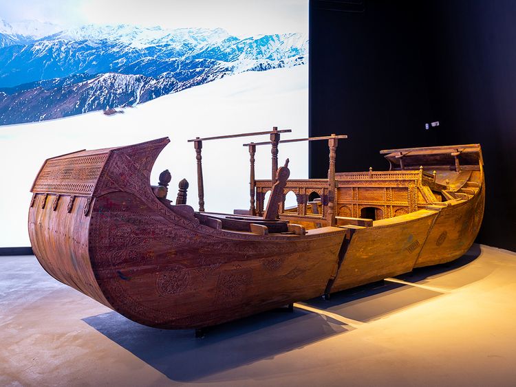 A traditional wooden carved boat by the Mohana tribe, an ancient community of Sindh displayed in the Pakistan Pavilion at Expo 2020 Dubai