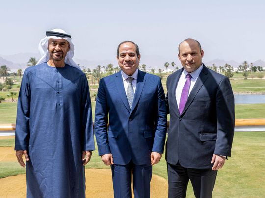 Sheikh Mohamed bin Zayed, Egypt's President Abdel Fattah Al Sissi, and Israel's Prime Minister Naftali Bennett posing for a picture after a meeting in the Egyptian Red Sea resort of Sharm El Sheikh.