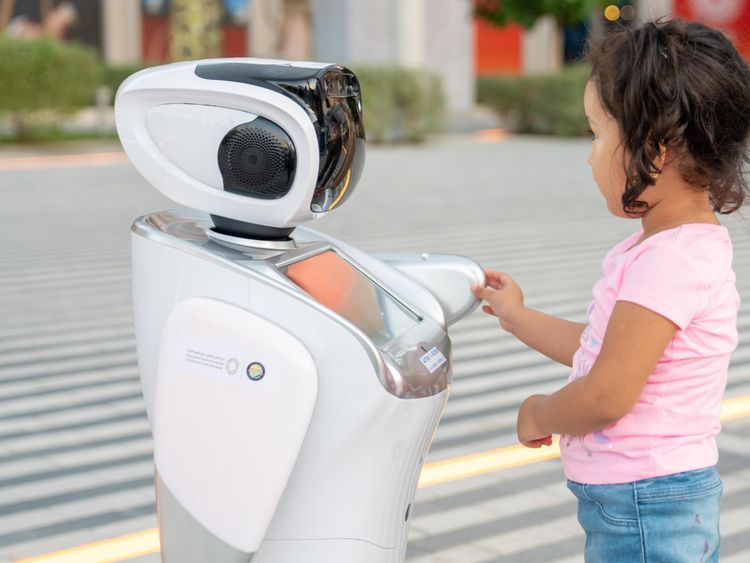 A child interacts with a robot at the Little Inventor stand_Large Image_m12383-1648288512779
