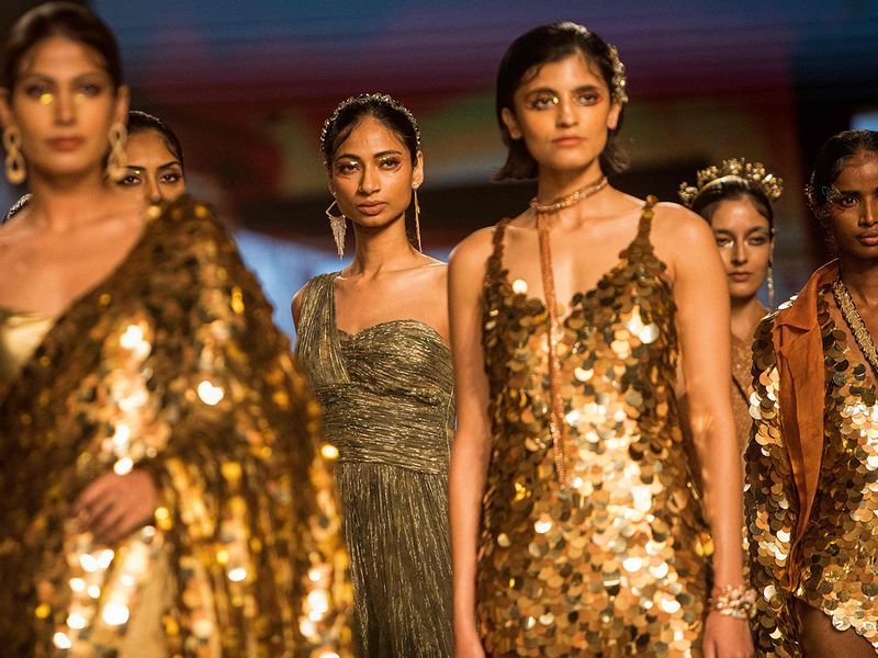 Models present creations by designer Prreeti Jaiin Nainutia during a fashion show at the FDCI x Lakme Fashion Week in New Delhi on March 26, 2022