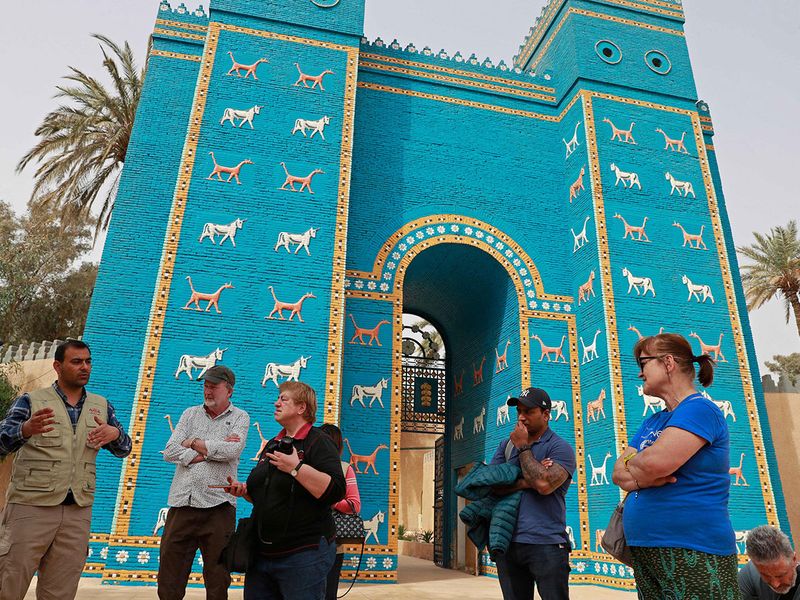 Foreign tourists visit the Ishtar Gate, the eighth gate to the ancient city of Babylon, some 100 km south of the Iraqi capital Baghdad. 