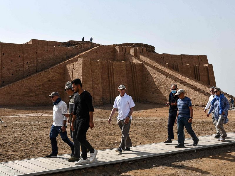 Visitors tour the Great Ziggurat temple in the ancient city of Ur in Iraq's southern province of Dhi Qar near the city of Nasiriyah.  