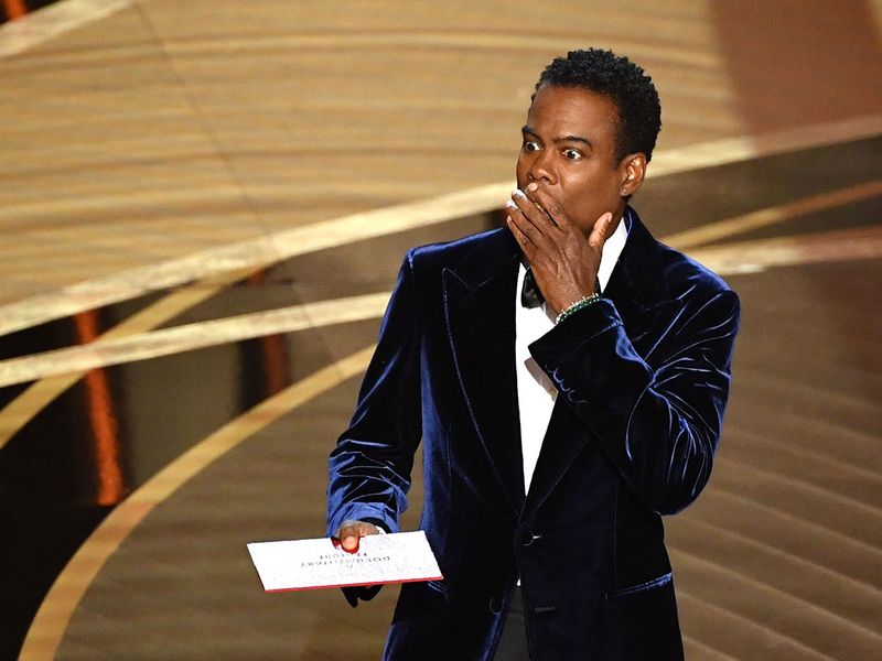  US actor Chris Rock speaks onstage during the 94th Oscars at the Dolby Theatre in Hollywood, California on March 27, 2022.