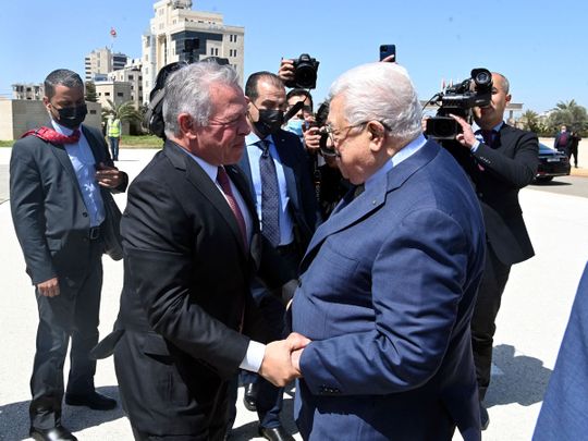 Jordan's King Abdullah shakes hands with Palestinian President Mahmoud Abbas in Ramallah, in the Israeli-occupied West Bank, March 28, 2022.