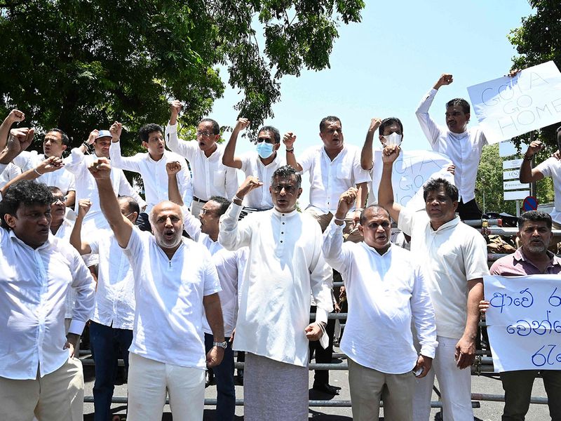 Sri Lanka's main opposition parliament members shout slogans as they protest in Colombo on April 3, 2022.