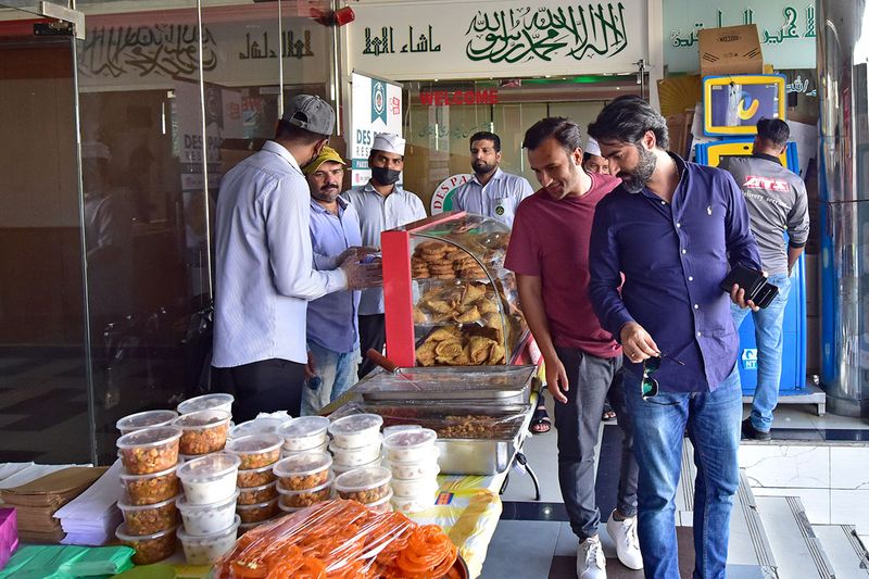 People pick up their Iftar meals from Des Pardes Restaurant in Oud Metha on the first day of Ramadan on April 2nd, 2022.