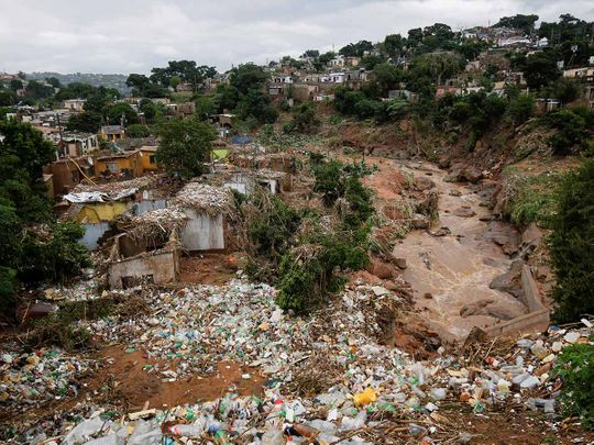 Destroyed homes and rubbish are seen after a river burst its banks in Ntuzuma
