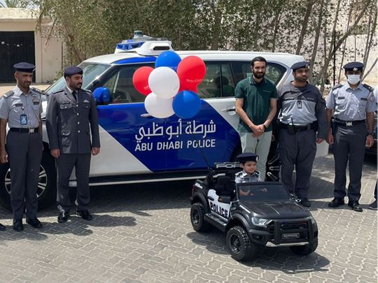 Abu Dhabi Police gift toy car to Emirati boy with terminal illness