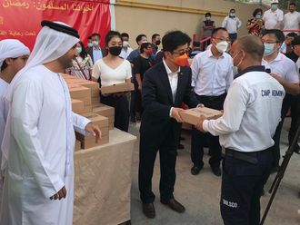 Chinese_Consul_General_Li_Xuhang_and_Omar_Al_Muthanna_from_Community_Development_Authority_03-1651407319688