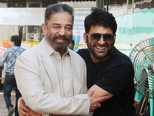 Actor Kamal Haasan and comedian Kapil Sharma pose for a picture at the promotion of his upcoming movie 'Vikram', on the sets of 'The Kapil Sharma Show', in Mumbai on May 5