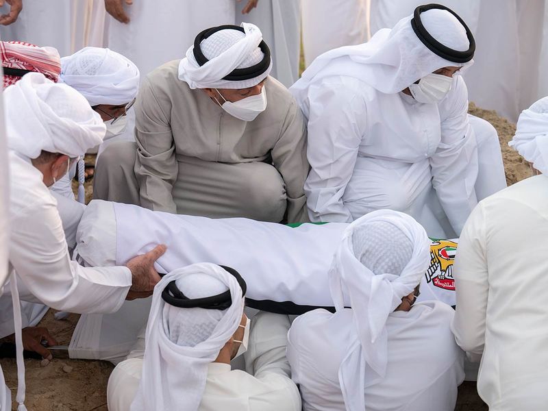 His Highness Sheikh Mohamed bin Zayed Al Nahyan, Ruler of Abu Dhabi (2nd R) attends the burial of Sheikh Khalifa bin Zayed Al Nahyan, President of the United Arab Emirates, at Al Bateen cemetery. Seen with HE Dr Mohamed Matar Salem bin Abid Al Kaabi, Chairman of the UAE General Authority of Islamic Affairs and Endowments (R).