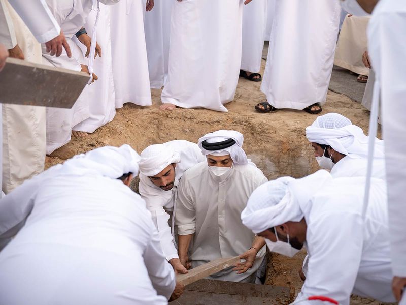 Sheikh Mansour bin Zayed Al Nahyan, UAE Deputy Prime Minister and Minister of Presidential Affairs (C) and Sheikh Mohamed bin Khalifa Al Nahyan, Abu Dhabi Executive Council Member (L), attend the burial of Sheikh Khalifa bin Zayed Al Nahyan, at Al Bateen cemetery.