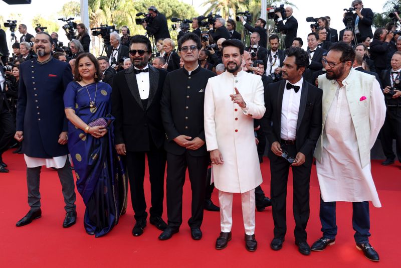 Ricky Kej, from left, Vani Tripathi, R. Madhavan, Prasoon Joshi, Anurag Thakur, Nawazuddin Siddiqui, and Shekhar Kapur pose for photographers upon arrival at the opening ceremony and the premiere of the film 'Final Cut' at the 75th international film festival, Cannes, southern France, Tuesday, May 17, 2021. 