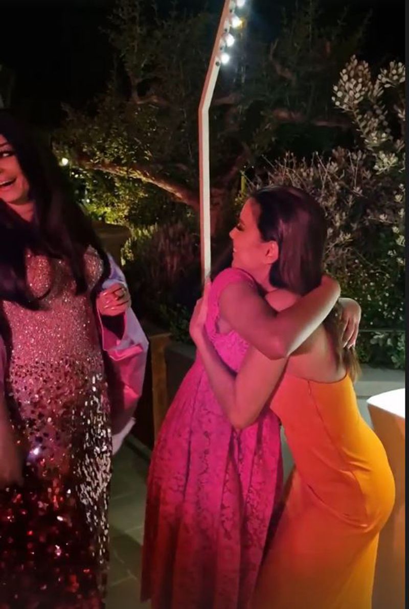 Eva Longoria hugging Aaradhya Bachchan as Aishwarya looks on
