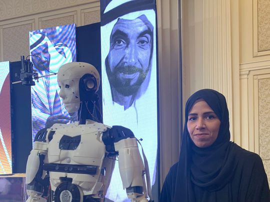 Latifa Al Hamadi with Rabdan, the robot she made to serve humanity, at a ceremony in Dubai to celebrate Emirati Talent Day