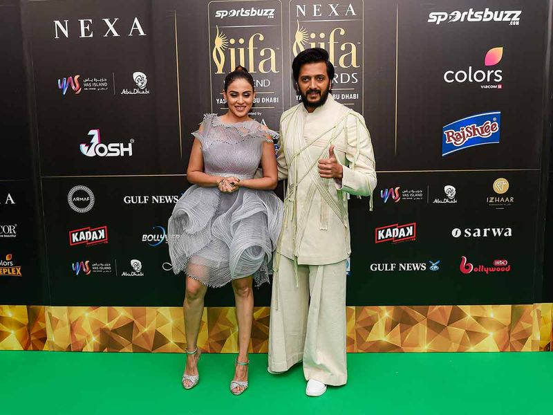 Actor Ritesh Deshmukh and wife actress Genelia D'Souza arrive for the IIFA Rocks green carpet   