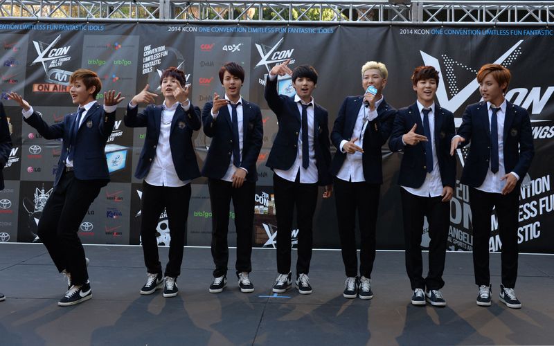 In this file photo taken on August 10, 2014 members of Korean K-pop group BTS arrive on the red carpet during the K-CON 2014 (Korean Culture Convention) at the Los Angeles Memorial Sports Arena