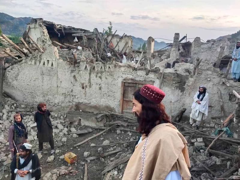 Afghans look at destruction caused by an earthquake in the province of Paktika, eastern Afghanistan. 