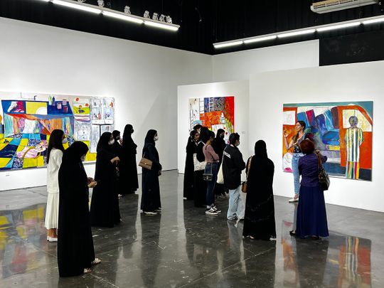Students-viewing-NFTs-hosted-by-Zawyeh-Gallery-at-Al-Serkal-Avenue-as-part-of-Abu-Dhabi-Art-Art-+-Tech-programme-by-MORROW-collective.-Photos-courtesy-of-MORROW-collective.-1655907114890