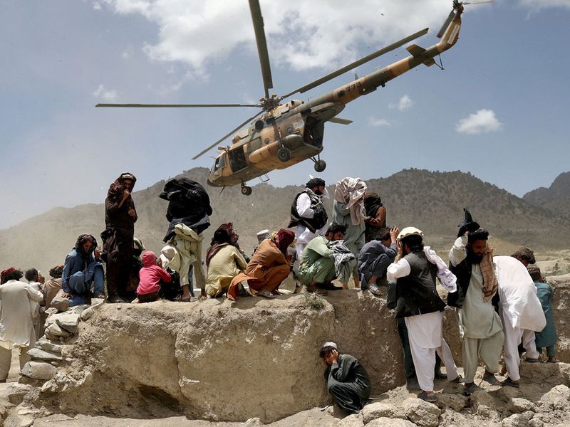 A Taliban helicopter takes off after bringing aid to the site of an earthquake in Gayan, Afghanistan.