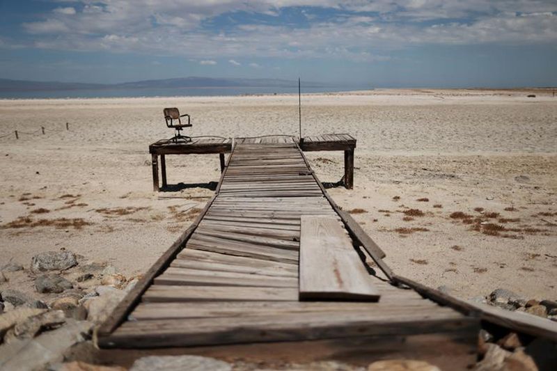 A former dock is seen on a Salton Sea’s beach, with the water much further away, as California faces its worst drought since 1977, in Salton City, California. 