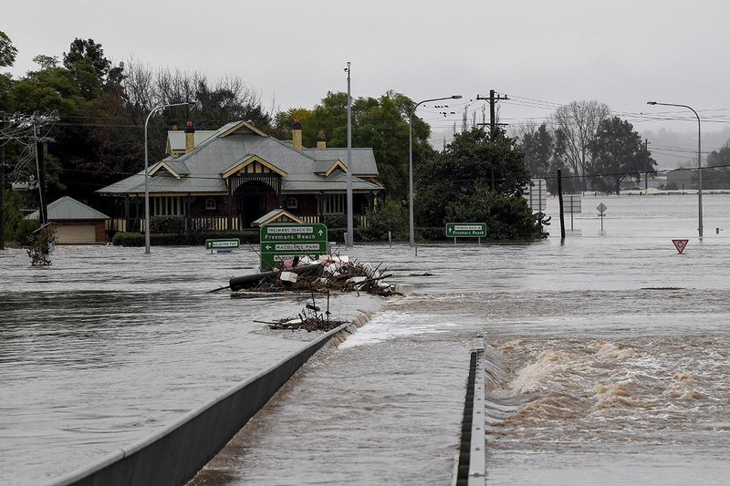 Debris is seen as the Windsor Bridge is submerged under floodwater from the swollen Hawkesbury River in Windsor, north west of Sydney, Australia, July 4, 2022.  