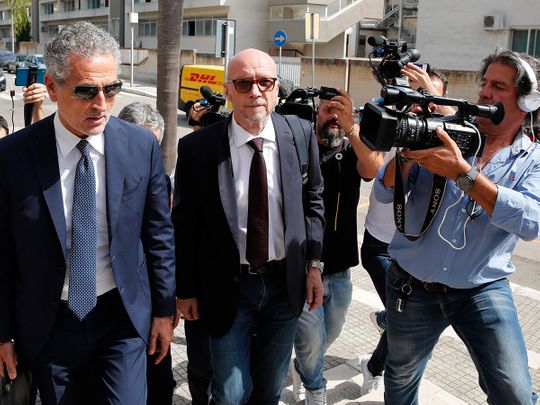 Canadian-born film director Paul Haggis, centre, arrives with his lawyer Michele Laforgia at Brindisi law court in southern Italy, Wednesday, June 22, 2022, to be heard by prosecutors investigating a woman’s allegations he had sex with her without her consent over the course of two days.