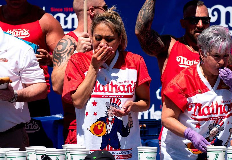 Miki Sudo competes in the Nathan's Famous Fourth of July hot dog eating contest in Coney Island on Monday, July 4, 2022, in New York. Sudo ate 40 hot dogs to win the women's division of the contest.  