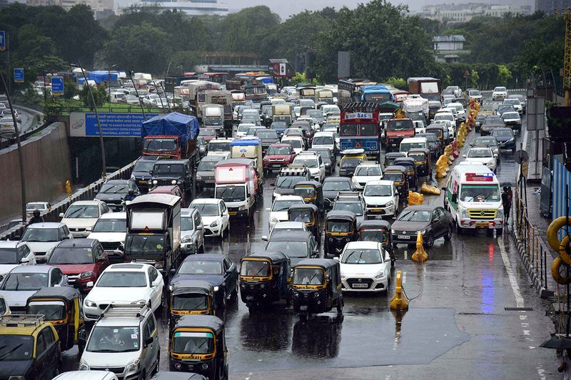 A long vehicular traffic jam seen on Western Express Highway due to heavy rainfall, at Vile Parle East, in Mumbai on Tuesday. (ANI Photo)