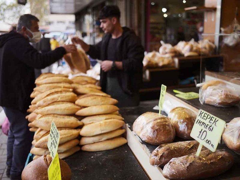 A man buys bread in Ulus district of the capital Ankara, Turkey. 