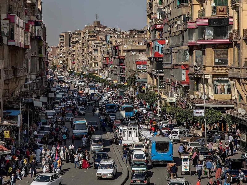 People crowd a major street in Cairo, Egypt. 