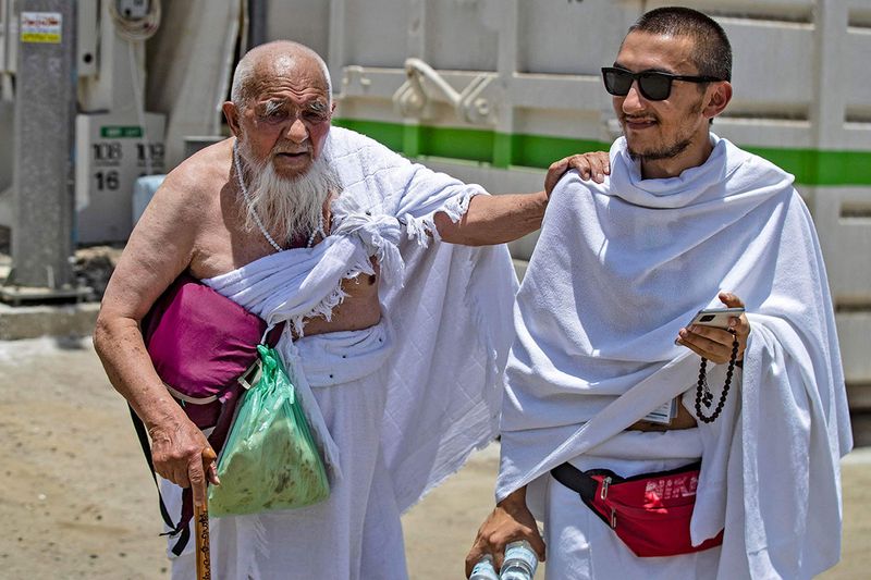 Muslim pilgrims arrive in Mina near the Saudi holy city of Mecca on July 7, 2022 during the annual Hajj pilgrimage.