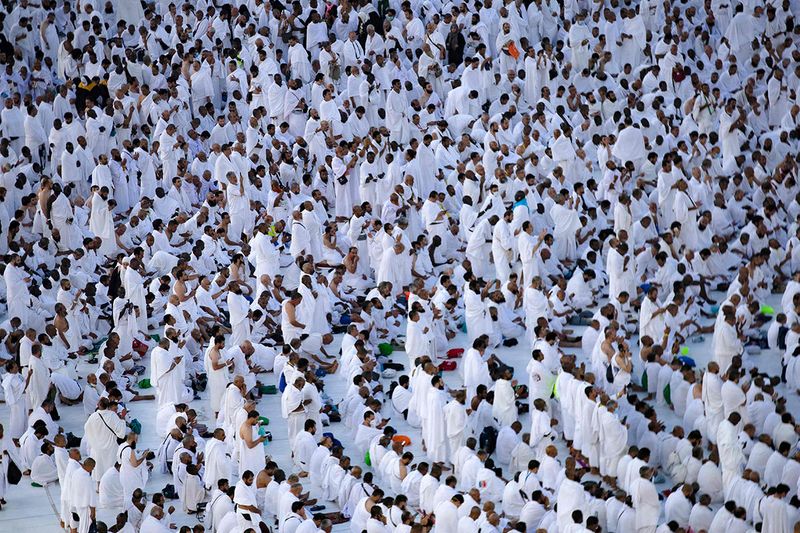 Muslim pilgrims pray around the Kaaba at the Grand Mosque, in Saudi Arabia's holy city of Mecca on July 6, 2022, during the annual Hajj pilgrimage. - One million fully vaccinated Muslims, including 850,000 from abroad, are allowed at this year's hajj in the city of Mecca, a big rise after two years of drastically curtailed numbers due to policies to stop the spread of infection.
