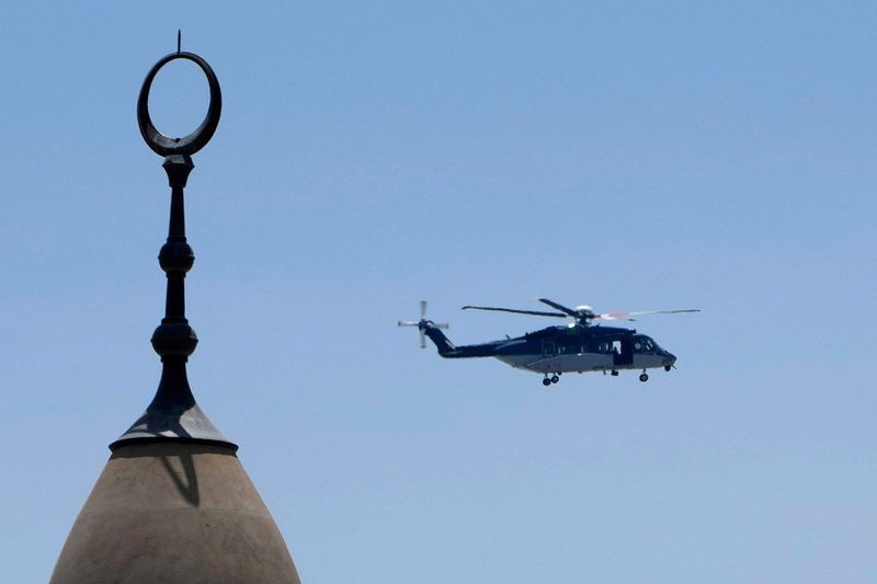 A Saudi police helicopter patrols over Namira Mosque in Arafat, on the second day of the annual hajj pilgrimage, near the holy city of Mecca, Saudi Arabia, Friday, July 8, 2022. Hundreds of thousands of Muslim pilgrims from around the world raised their hands to heaven and offered prayers of repentance on the sacred hill of Mount Arafat in Saudi Arabia on Friday, an intense day of worship considered to be the climax of the annual Hajj. (AP Photo/Amr Nabil)
