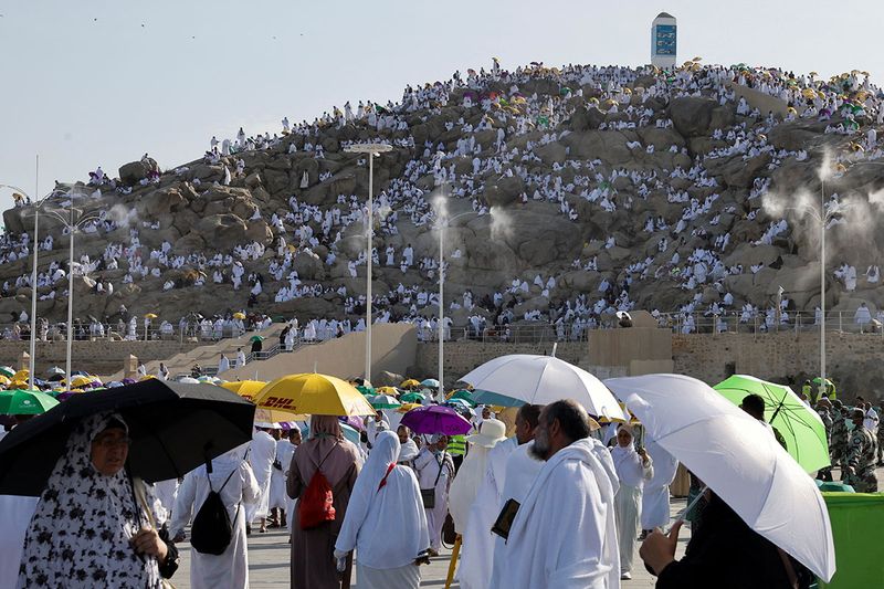 Muslim pilgrims gather on Mount of Mercy at the plain of Arafat during the annual haj pilgrimage, outside the holy city of Mecca, Saudi Arabia, July 8, 2022. 