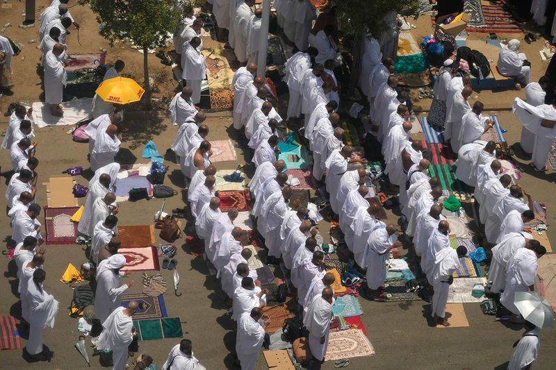 Muslim pilgrims perform Friday Prayers outside the Namira Mosque in Arafat, on the second day of the annual hajj pilgrimage, near the holy city of Mecca, Saudi Arabia, Friday, July 8, 2022.