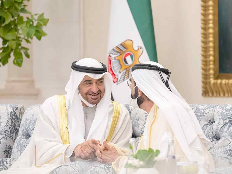 Sheikh Mohamed bin Zayed (left) speaks with Sheikh Mohammed bin Rashid during an Eid Al Adha reception, at Mushrif Palace. 